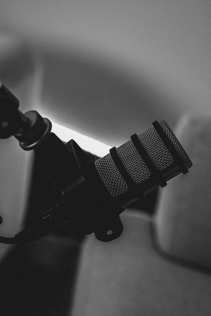 Rode PodMic on boom arm in Content Hype's Essendon studio, B&W close-up